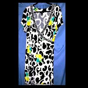 Black and white dress with green floral pattern